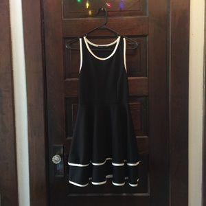 Black mini dress, with white piping